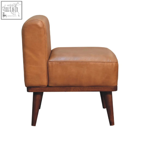 Tan buffalo backrest footstool with tan leather armchair style, solid mango wood chestnut base, and tapered legs