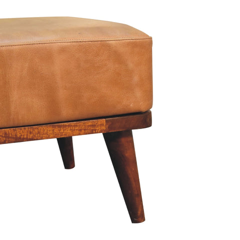 Tan buffalo leather footstool with wooden base and tapered legs perfect as a tan leather ottoman for any room