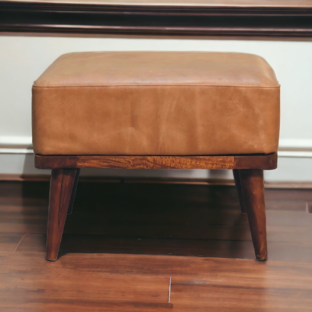 Tan buffalo leather footstool with wooden base tapered legs stylish tan leather ottoman for living room seating