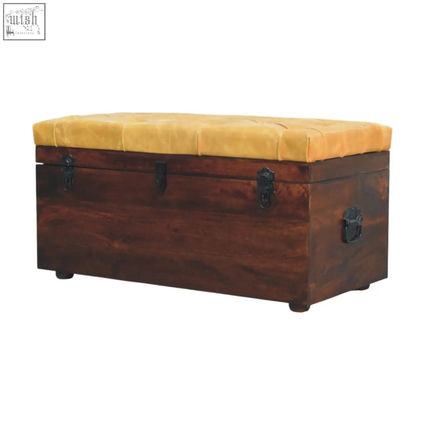 A rustic storage trunk bench with tan leather, dark wood, tufted mustard-yellow cushion, and black metal latches
