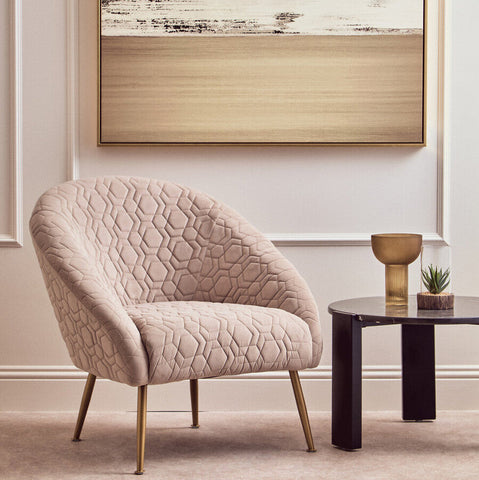 Beige quilted velvet natural occasional chair with gold tone metal legs for stylish seating