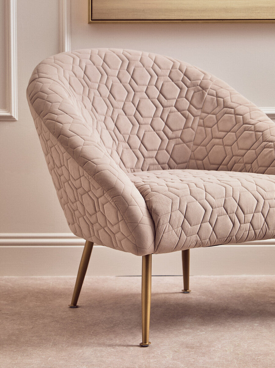 Beige quilted velvet natural occasional chair with gold tone metal legs perfect for any room