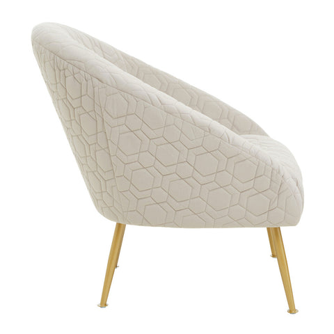 Cream-colored natural occasional chair with hexagonal quilted upholstery and slender gold-tone metal legs