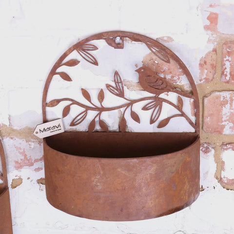 Rustic tanu wall mounted metal planter with bird leaf design and weathered copper finish for indoor outdoor use