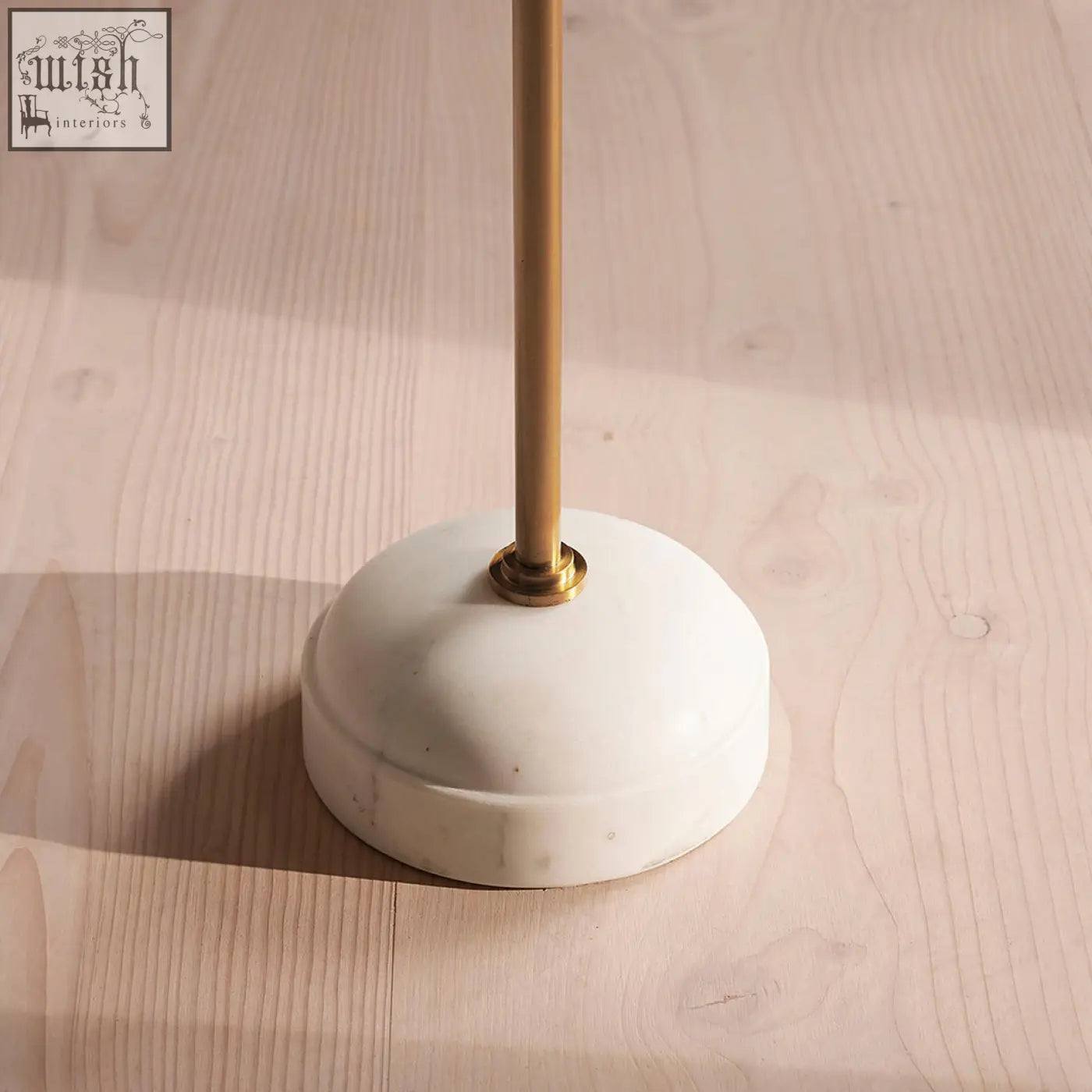 Tarantino side table with sleek white marble base and polished brass stem ideal for modern lamps with stainless steel accents