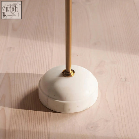 Tarantino side table with sleek white marble base and polished brass stem ideal for modern lamps with stainless steel accents