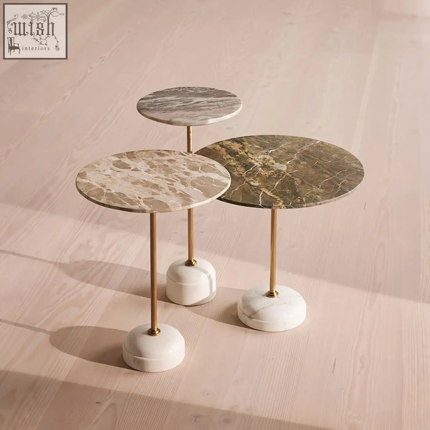 Three elegant tarantino side tables with beige and green marble tops on stainless steel gold-toned legs and white bases