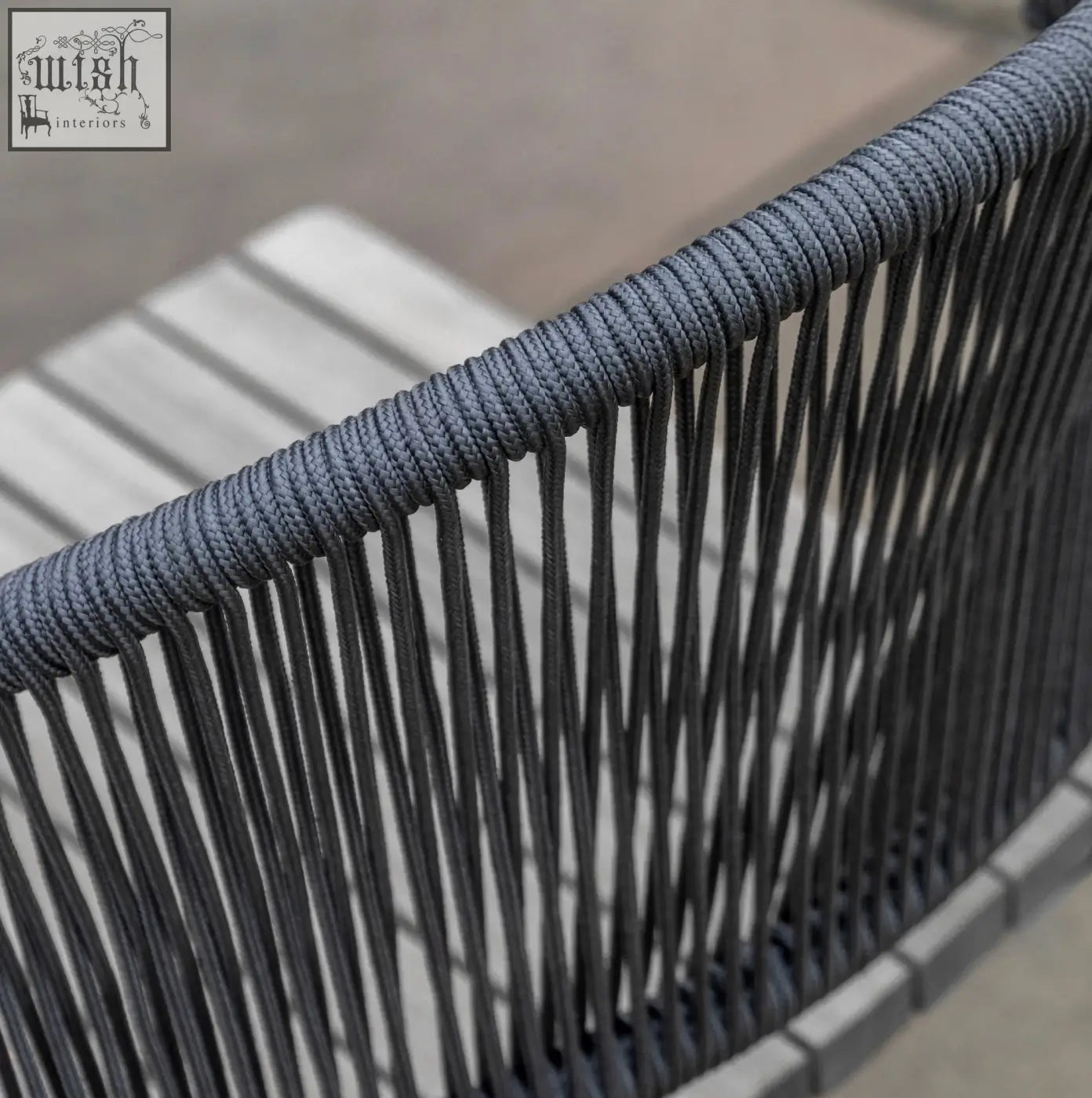 Back of gray woven rope dining chair with textured braided top edge taranto dining chair x 2