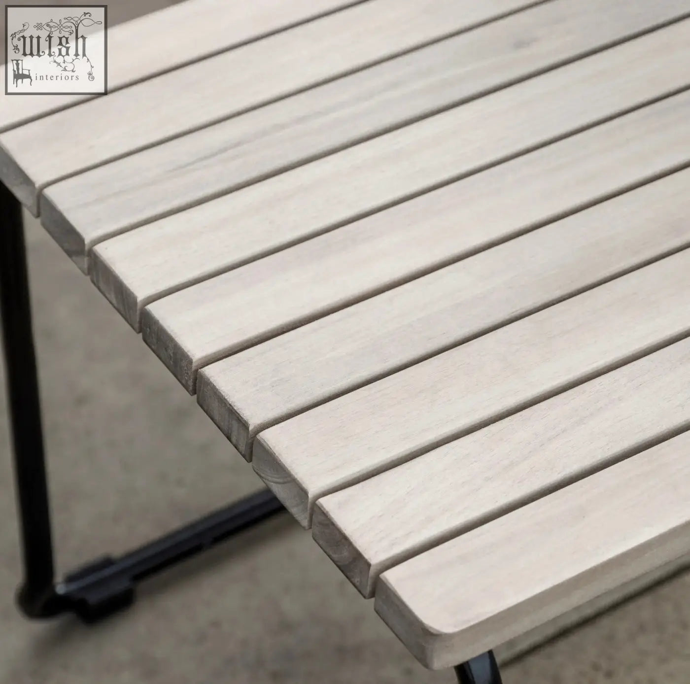 Light gray wooden slat dining table with black metal legs paired with taranto dining chair x 2