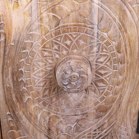 Tarinda carved wooden storage cabinet with hand carved door panel featuring intricate circular patterns and floral motif