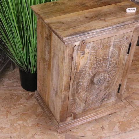 Tarinda carved wooden storage cabinet with intricate circular patterns and rustic light brown wooden finish
