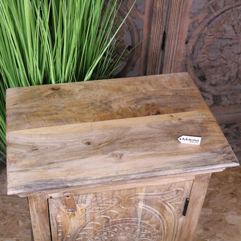 Tarinda carved wooden storage cabinet with hand-carved floral patterns and rustic light brown finish wooden storage cabinet