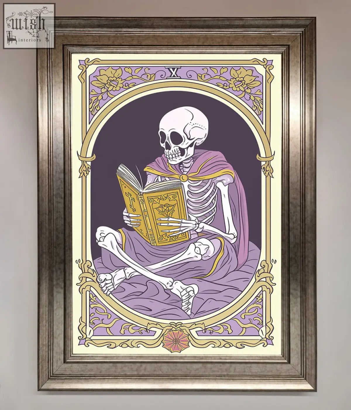 Framed print of a tarot skeleton reader in a purple robe holding a golden book with gold floral border design