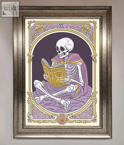 Framed print of a tarot skeleton reader in a purple robe holding a golden book with gold floral border design