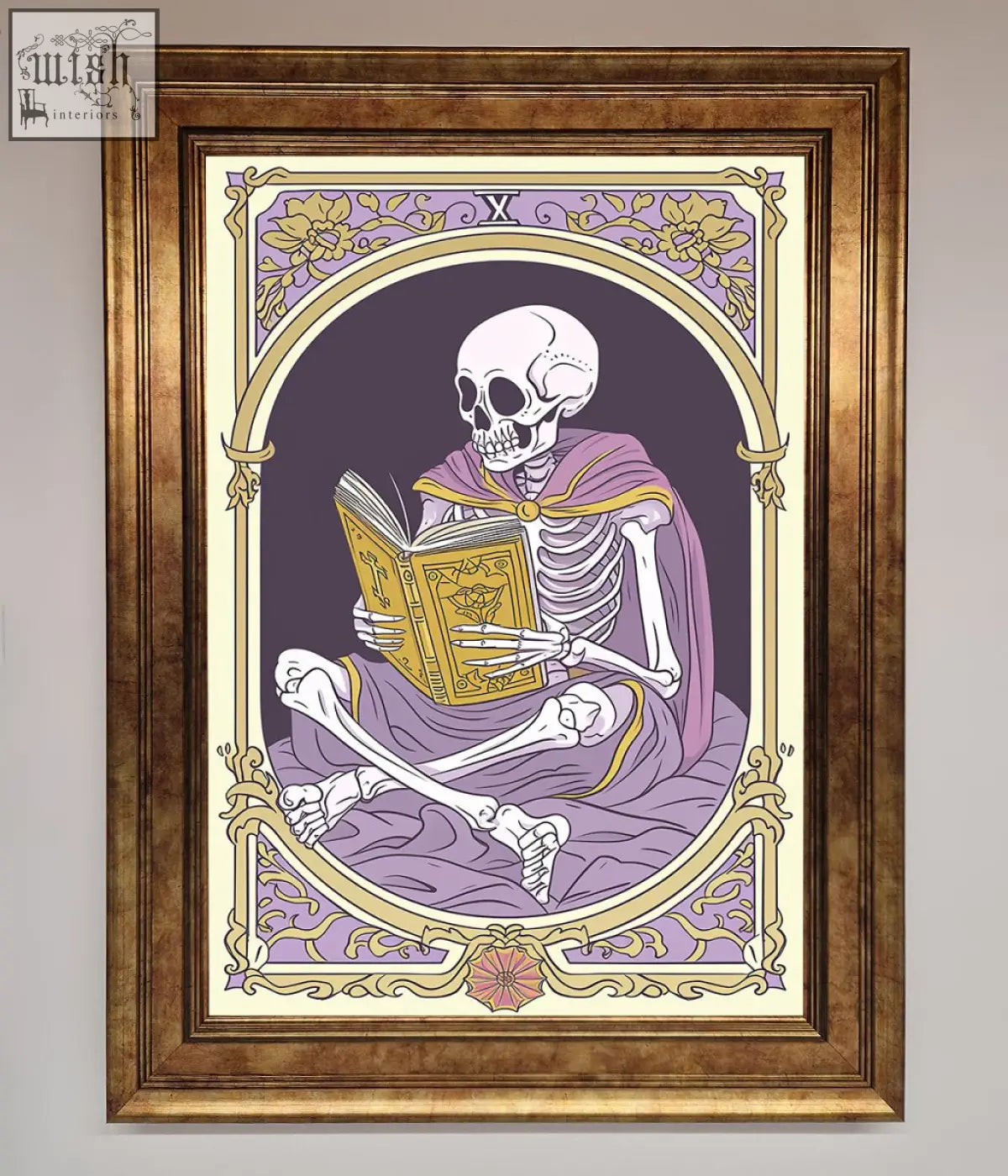 A framed print showing a tarot skeleton reader in a purple robe holding an ornate golden book in an arched border