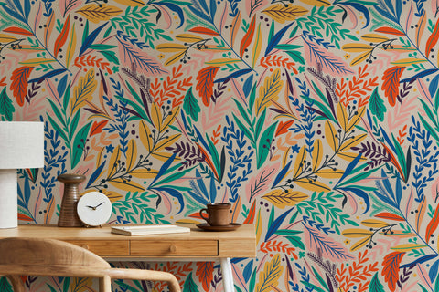 Vibrant tate floral wallpaper with colorful green orange blue and pink leaves on a soft beige background
