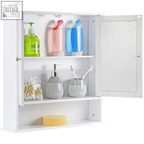 White double mirrored bathroom cabinet with wooden frame and shelves holding toiletries by taylor brown maine white