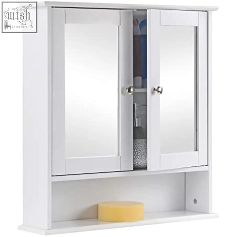 White double mirrored bathroom cabinet maine white with silver knobs and lower shelf holding a yellow sponge