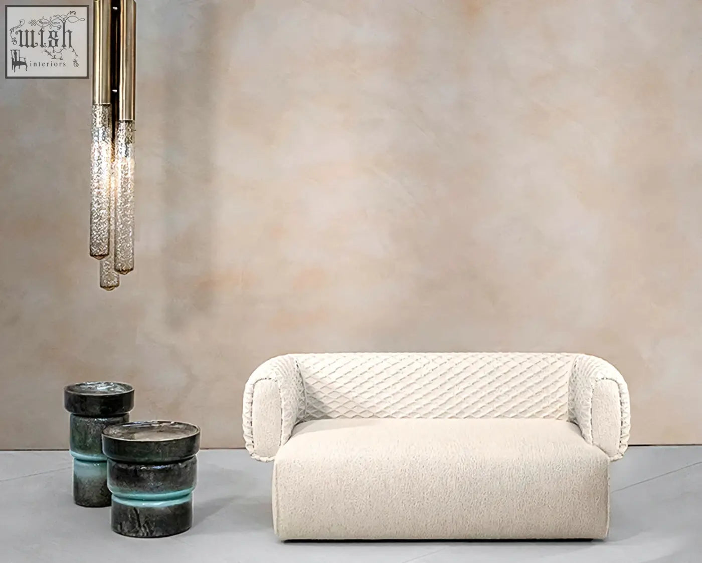 Cream-colored plush quilted two seater sofa with soft textured fabric and rounded armrests offer financing available