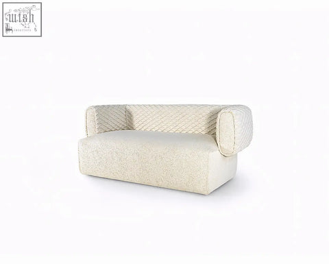 Cream-colored taylor three seater sofa with plush textured fabric and quilted backrest offering financing options