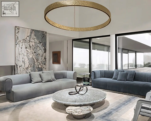 Gold circular pendant light with textured hammered finish shown above taylor two seater c shape sofa offering financing and shipping cost options