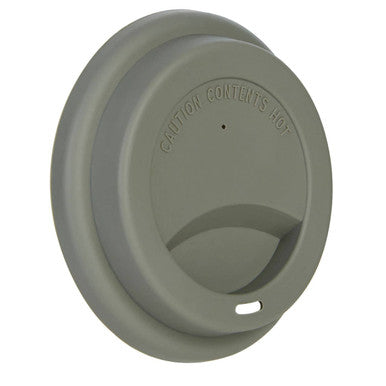 Gray silicone lid with small drinking opening on a taza ditsy floral ceramic travel mug