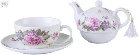 White porcelain tea for one teapot with pink floral design and tassel in a beautiful gift box from a london boutique