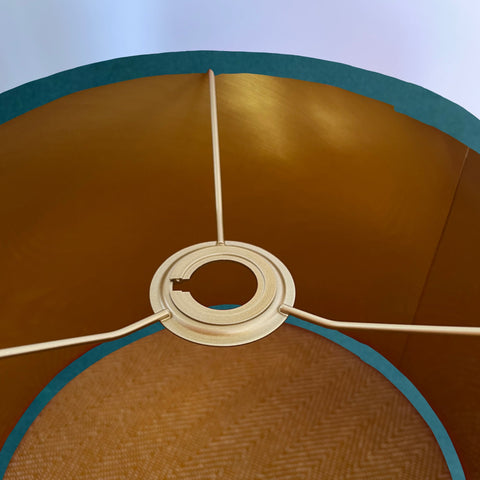 Interior of a teal velvet drum lampshade with 30cm height and metallic brushed gold lining ceiling shade details