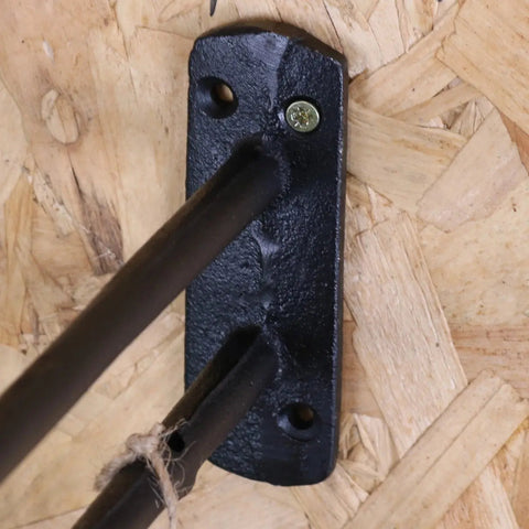 Black wrought iron leg with matte finish secured by one screw for tehla industrial style shelf bracket set