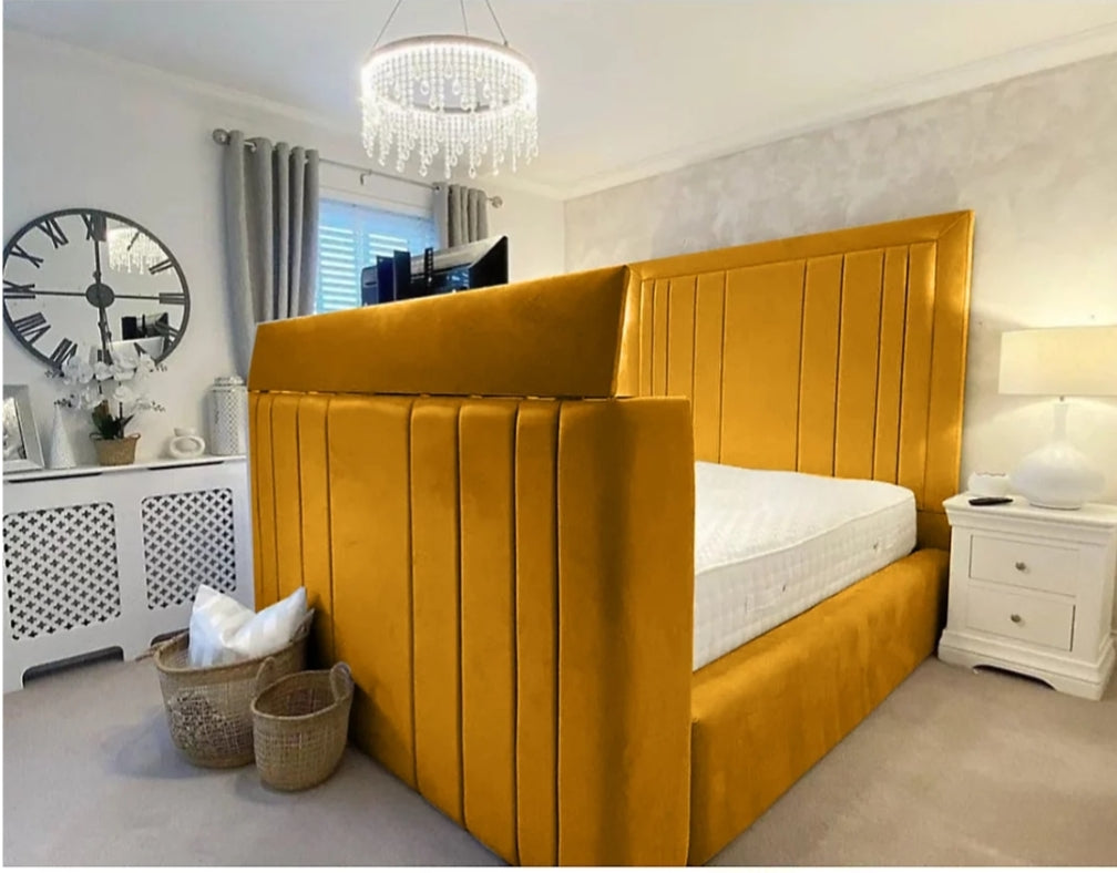 A plush mustard-yellow velvet telly bed with tufted panelled headboard and footboard fits tvs small double size