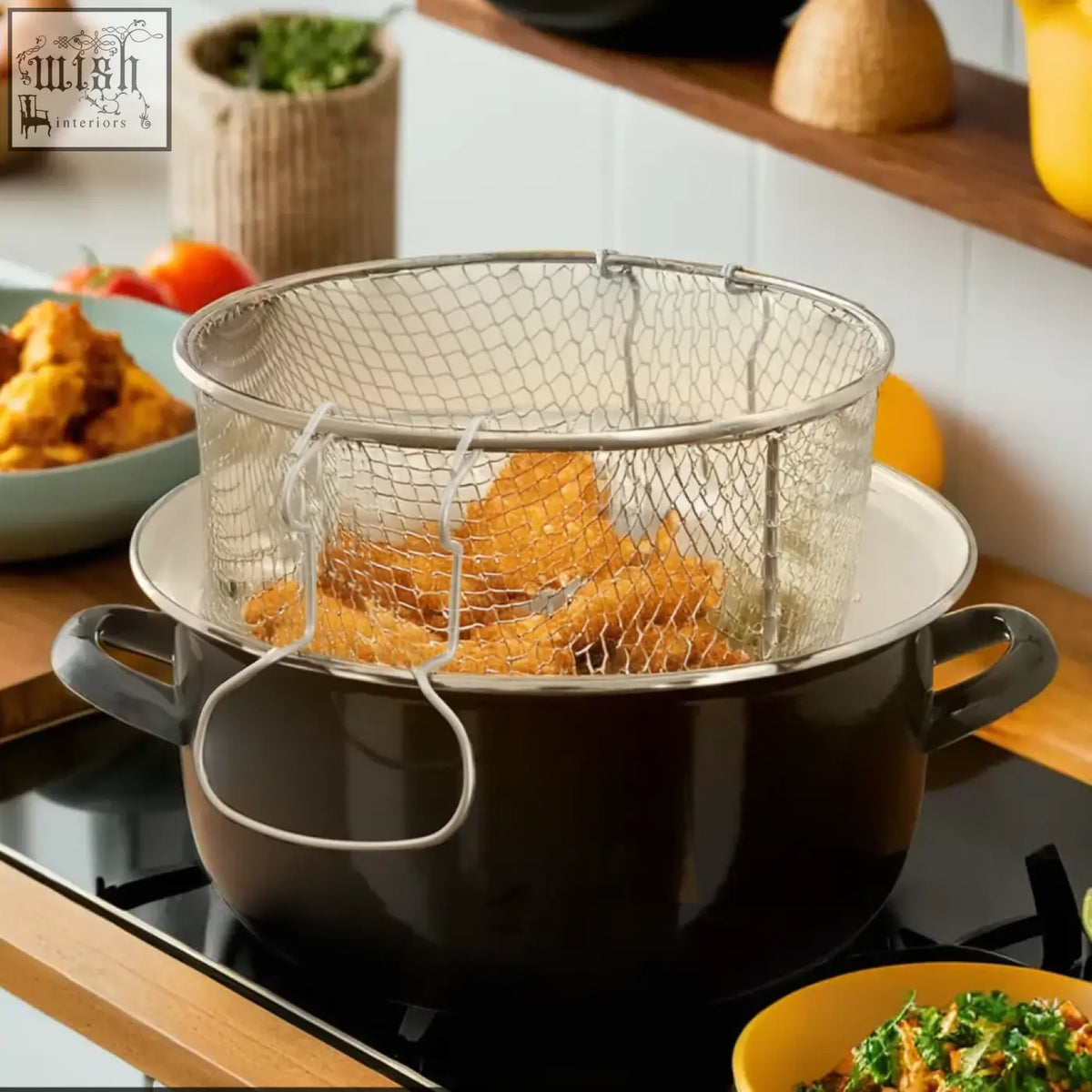 Stainless steel mesh frying basket with sturdy handle inside telo black deep fryer pot on stovetop black deep fryer