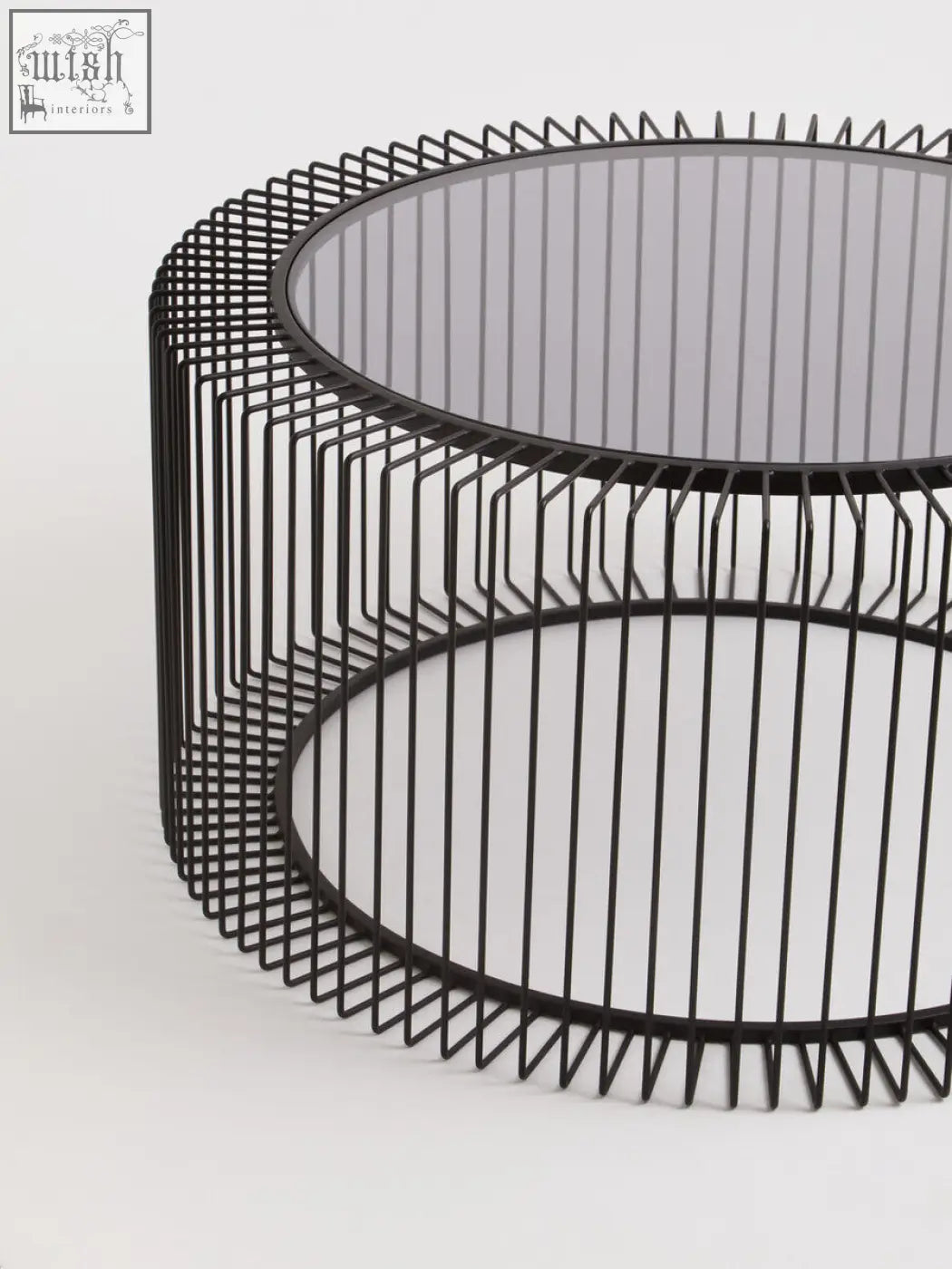 Black metal wireframe coffee table with round tempered glass top perfect as a modern round coffee table