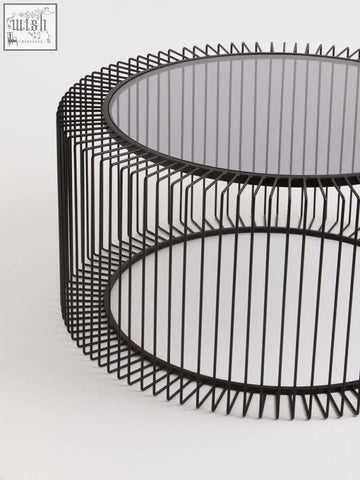 Black metal wireframe coffee table with round tempered glass top perfect as a modern round coffee table