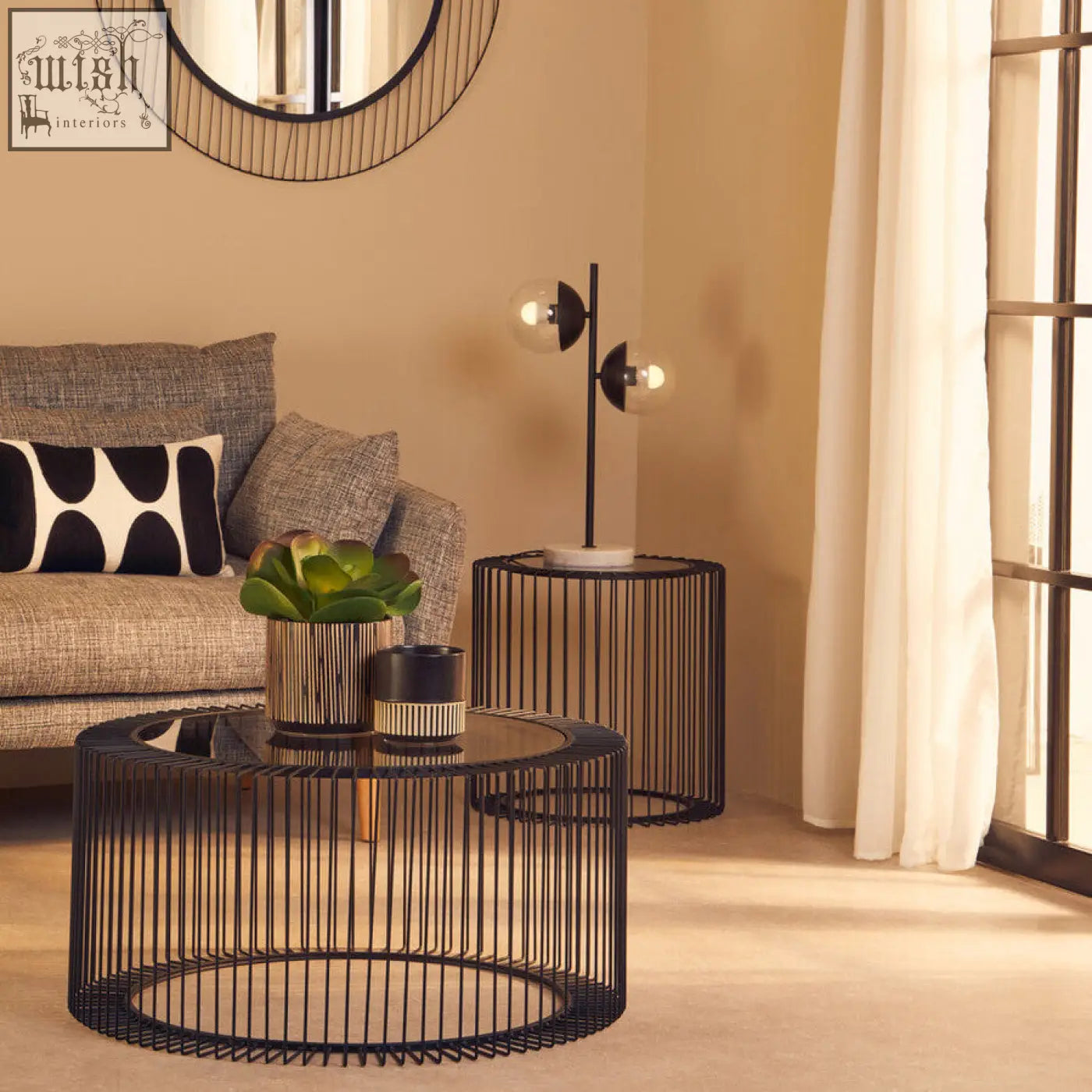Black wireframe round coffee table with tempered glass top and cage design base trento style