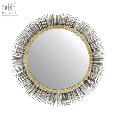 Templer brass finish wall mirror with a sunburst design featuring gold and silver metallic rods and an ornate border
