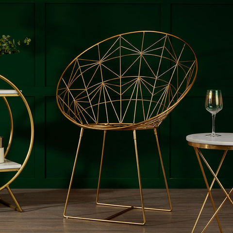 Golden wireframe geometric occasional chair with modern minimalist design in templar gold frame style