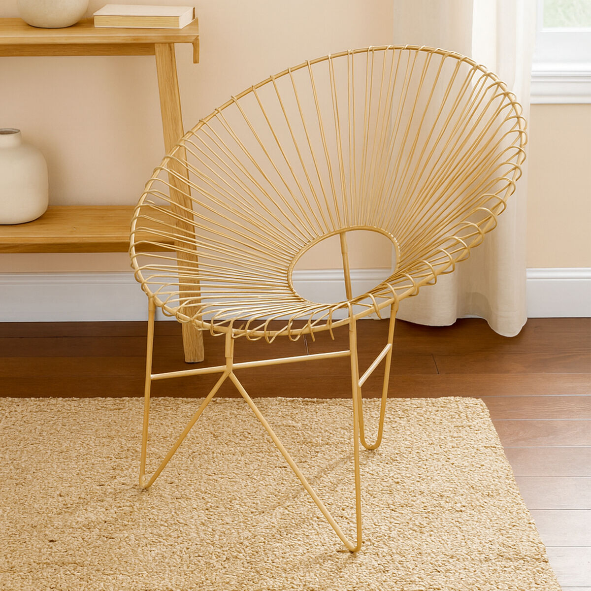 Templar gold wire frame occasional chair with a circular fan-like backrest and slender legs shown from the back
