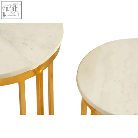 Two nested side tables with round white marble tops and gold frame set metal legs for stylish living space
