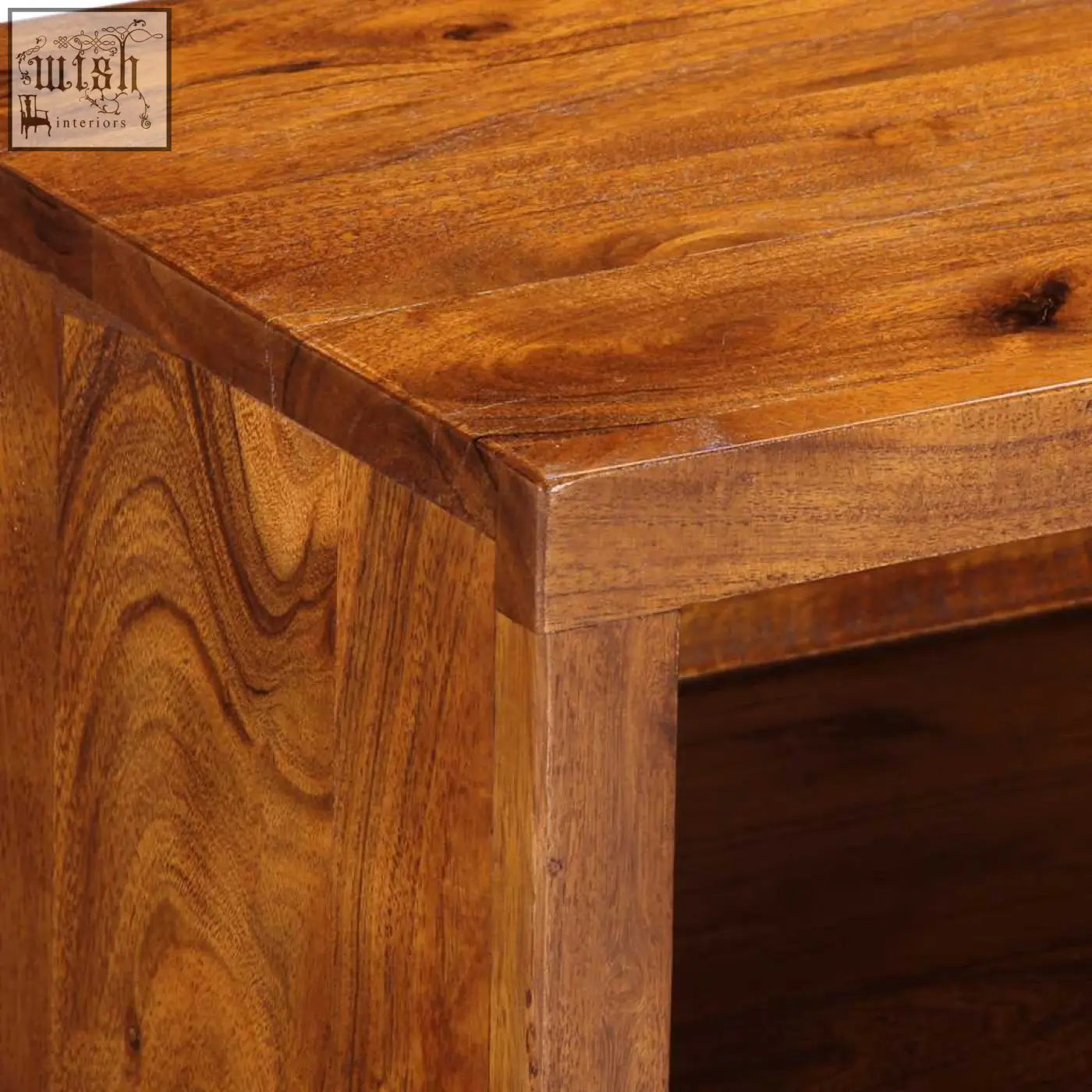 Rich warm-toned wooden coffee table made from solid acacia wood with smooth polished finish and natural grain patterns