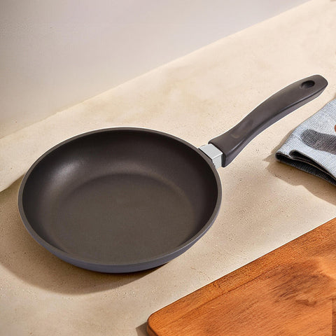 Black tenzo 24cm non stick frying pan with sleek ergonomic handle and silver rivet attachment for easy cooking