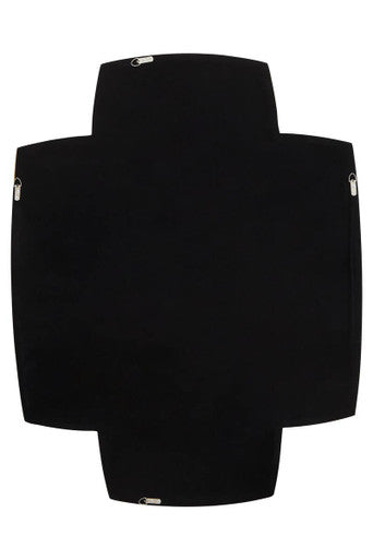 Black cross-shaped blanket with silver zipper pulls displayed behind terni gold finish wall mirror with gold-effect frame