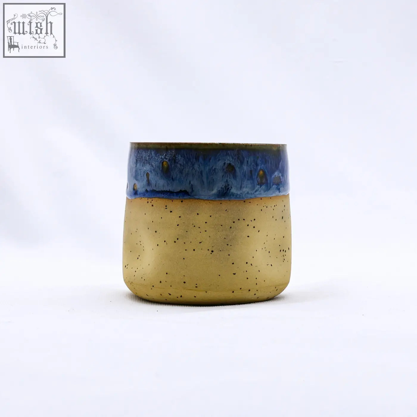 Terrablu goccia handmade ceramic stoneware cup with speckled gold body and vibrant blue glazed rim