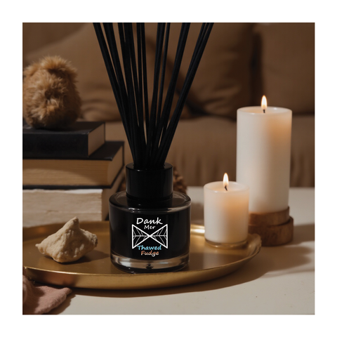 Black glass reed diffuser with thawed fudge fragrance oil and black reeds in a thawed fudge single diffuser bottle