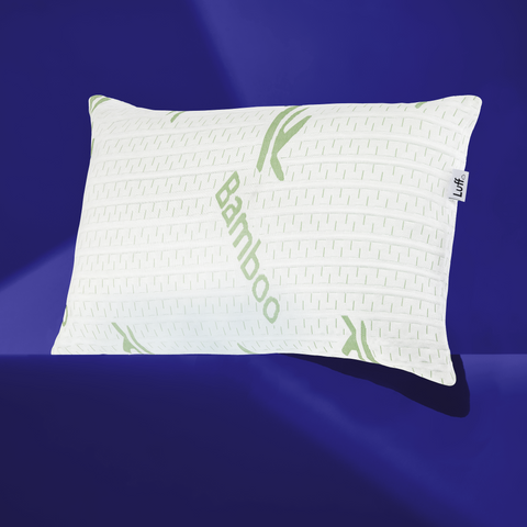 White bamboo pillow from the bamboo hotel premium pillow with green leaf bamboo text and subtle texture pattern