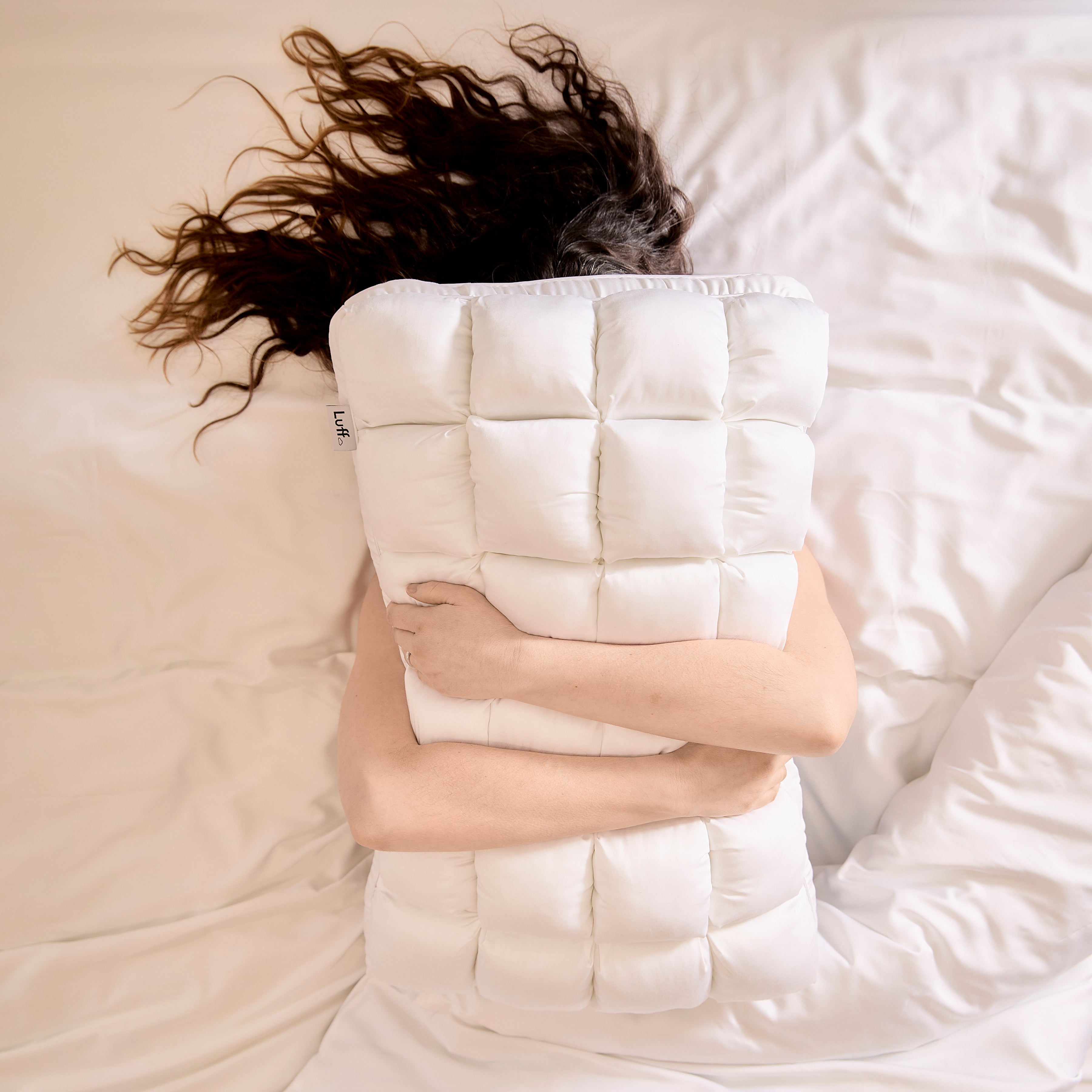 White quilted bamboo paradise pillow with grid pattern made of soft fabric for cozy sleep and comfort
