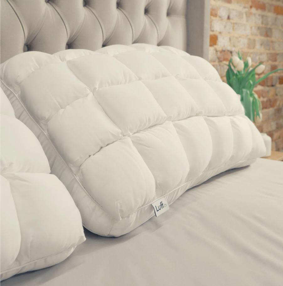 The bamboo paradise pillow is a white quilted pillow with soft plush texture and subtle stitching details