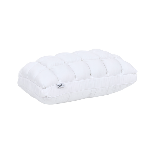 The bamboo paradise pillow is a white quilted pillow with soft plush texture and subtle stitching details