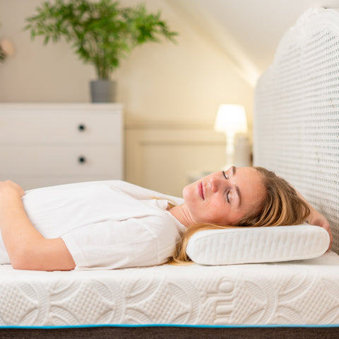 The bamboo skinny pillow white memory foam with textured ribbed surface and subtle blue trim along the base