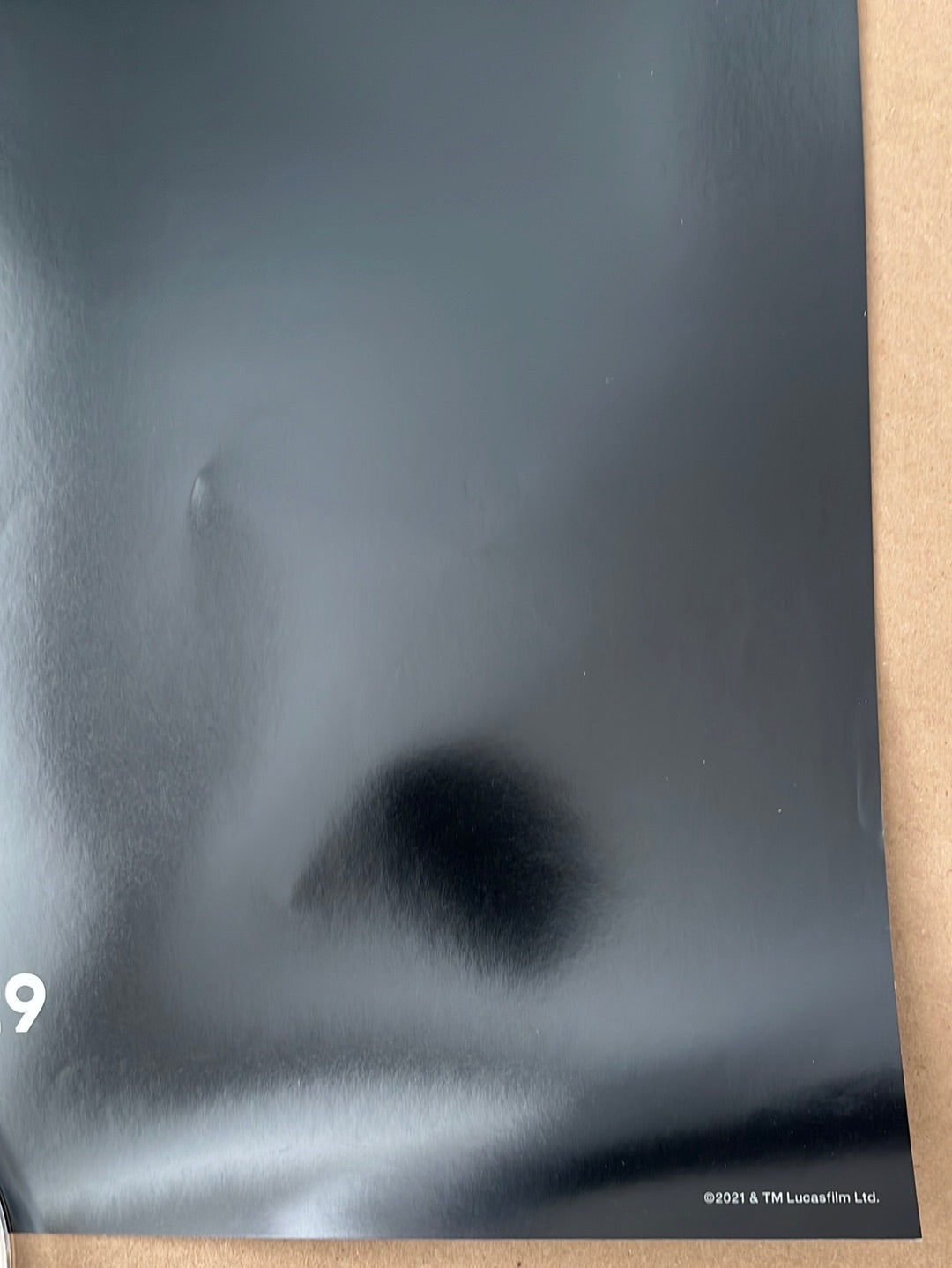 A blurry black and white face image on the original us one sheet tv poster for star wars the book of boba fest 2021