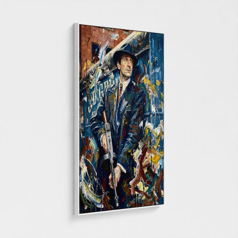 The brum don framed canvas shows a man in a dark suit and hat holding a rifle against bold blue yellow red strokes